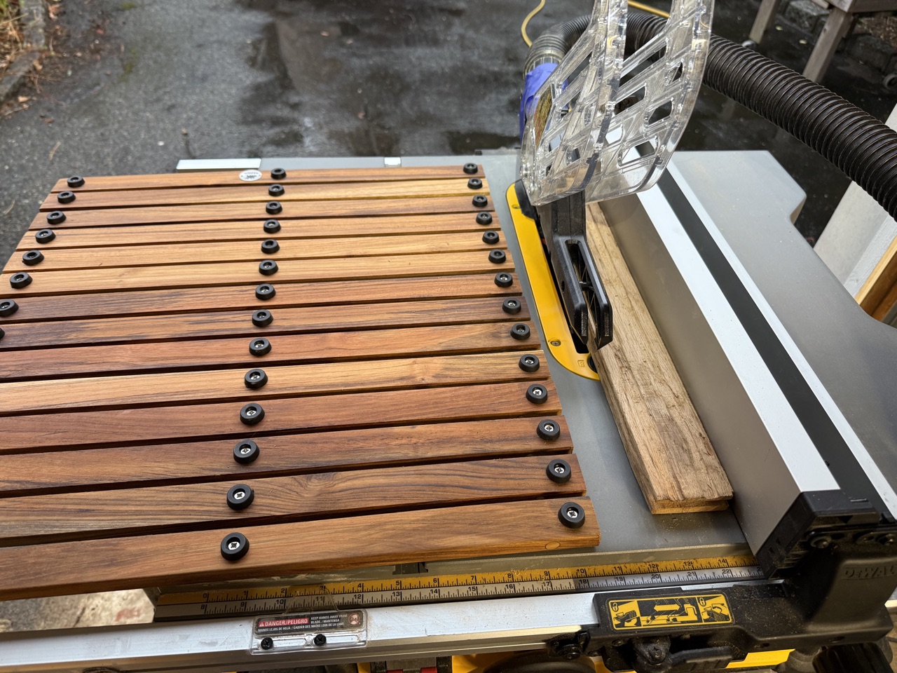 Teak string mat being cut to size on a table saw to fit the head sole