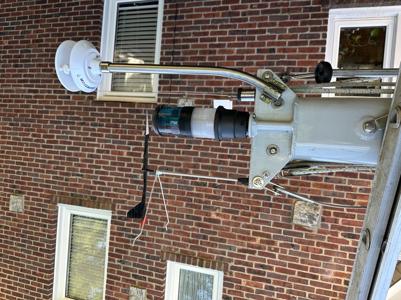 Finished WSO200 installation at the masthead with the NMEA 2000 cable routed down the mast