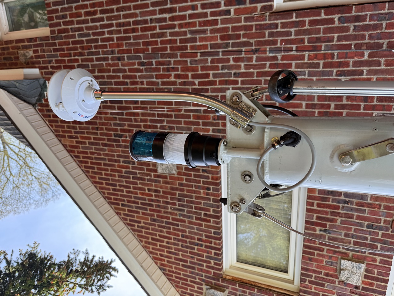 Maretron WSO200 ultrasonic wind station mounted on a bent stainless pole at the masthead of Queen of Hearts