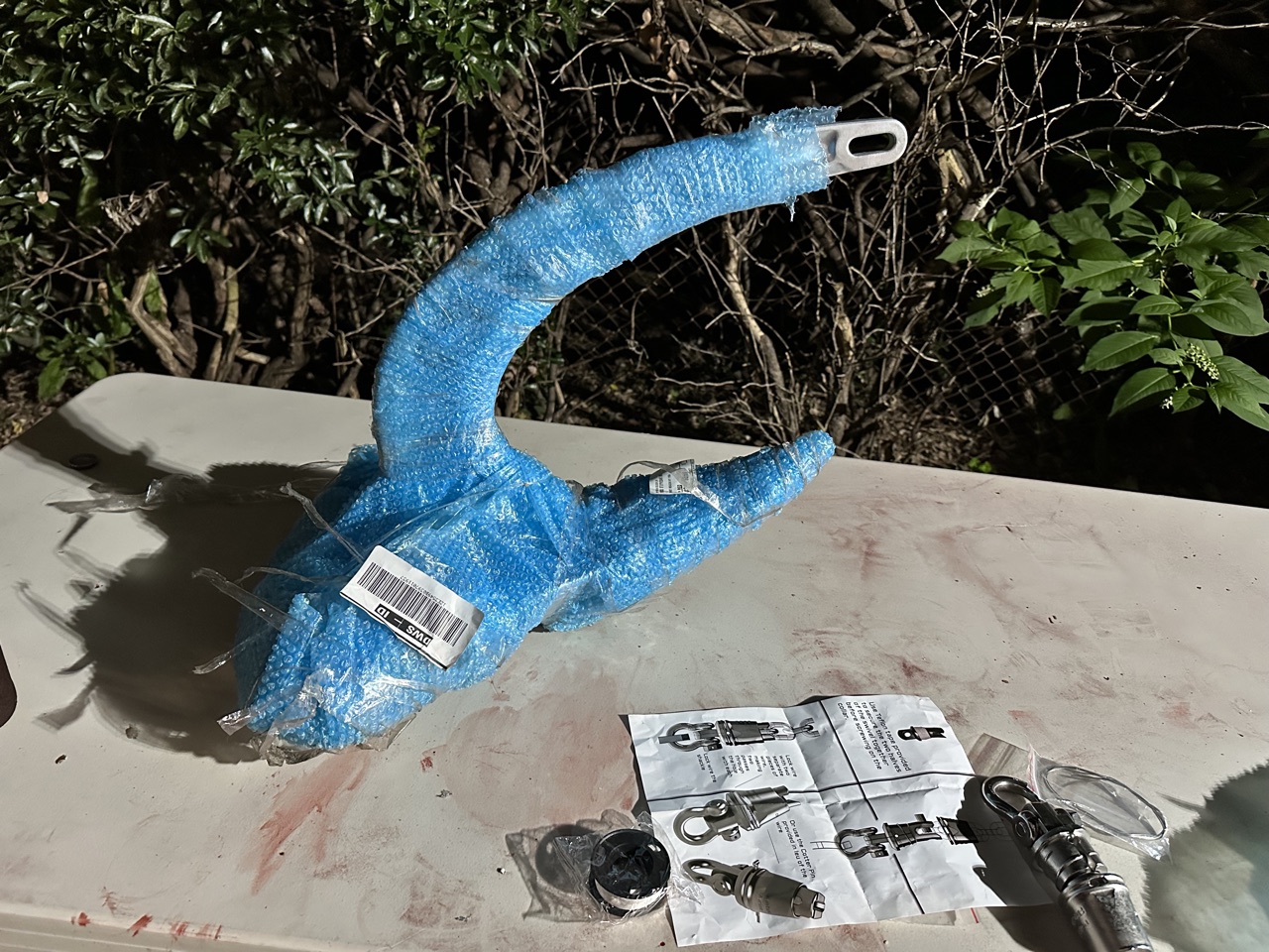 Rocna Vulcan anchor arriving in shipping packaging, the box shape making it obvious what's inside