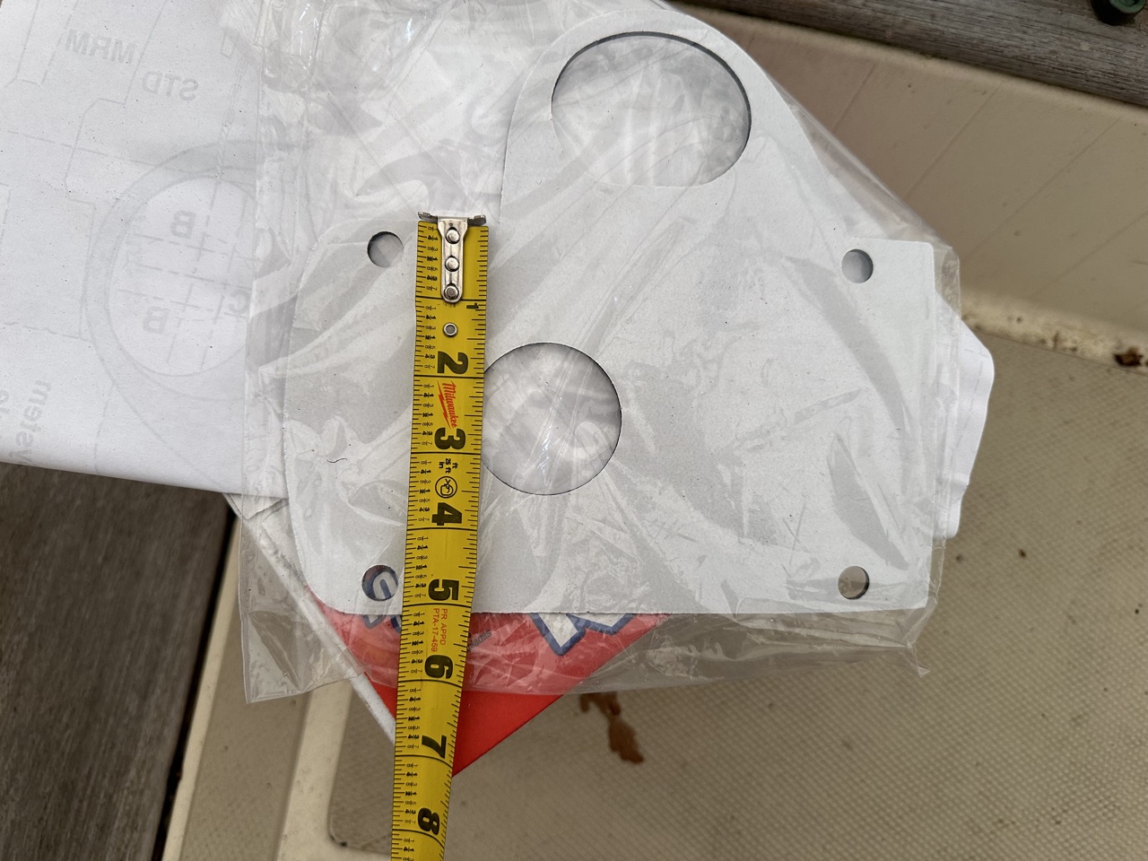 Lewmar H2 gasket measured for height with tape measure