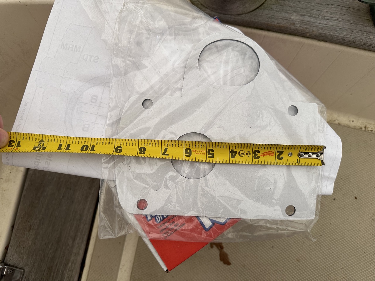 Lewmar H2 gasket measured across its width with tape measure