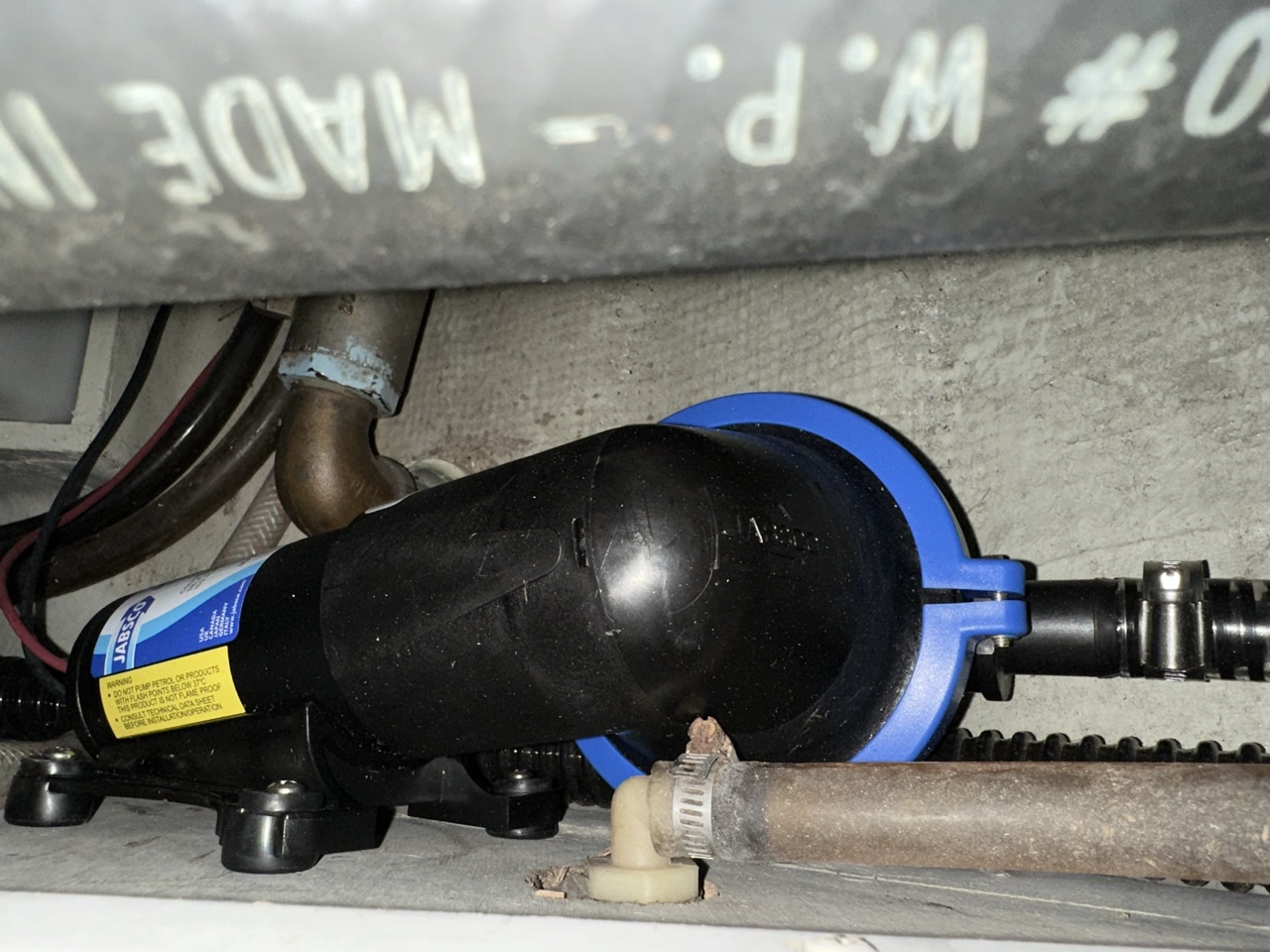 Jabsco diaphragm bilge pump mounted remotely in the bilge of Queen of Hearts