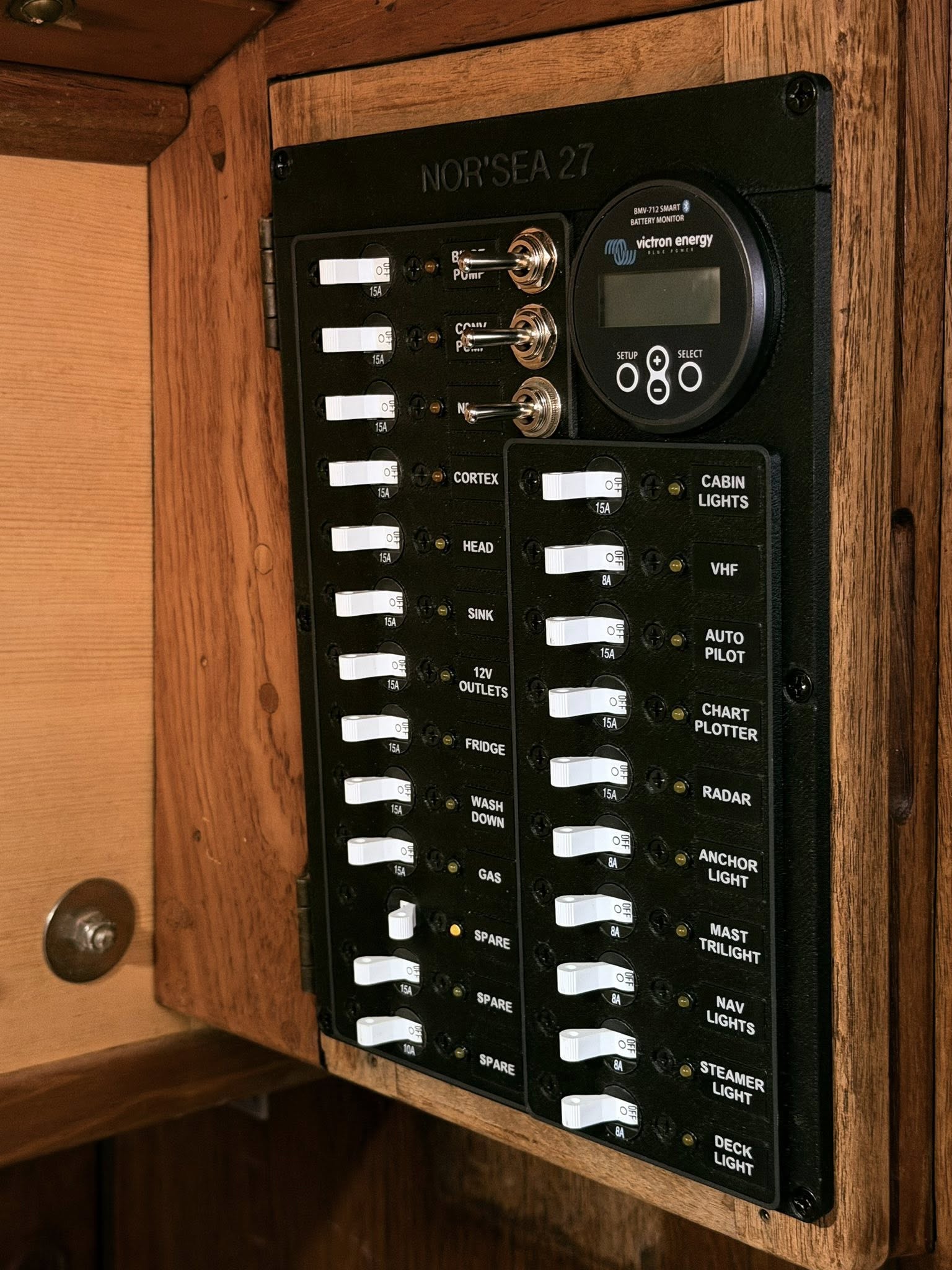 Custom 3D-printed Nor'Sea 27 electrical panel with Blue Sea circuit breakers and Victron BMV-712