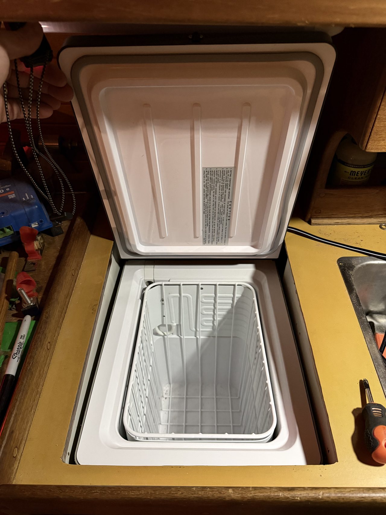 Engel MT27 refrigerator installed in the Nor'Sea 27 icebox opening